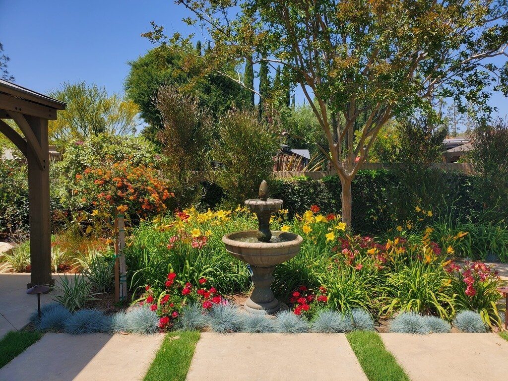 Lush garden with water fountain